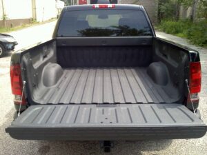 Truck coated with black bed liner material