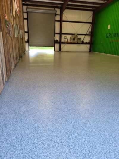 Commercial warehouse floor coated with Primetech 21, full broadcast vinyl chips and Protech 7072 topcoat