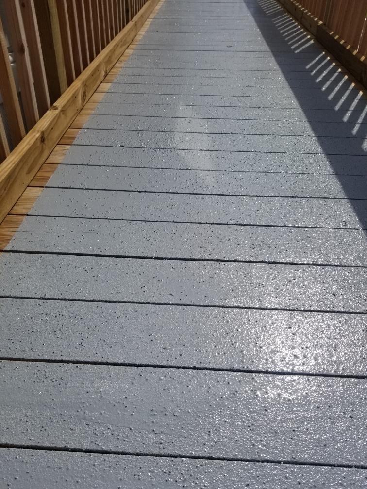 Wooden walkway coated with Primetech 2180, Protech 7072 and nonskid aggregate